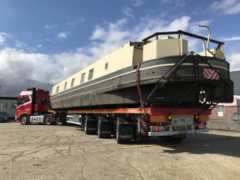Extendable Rear Steer Flatbed Trailer carrying an 18m long Barge